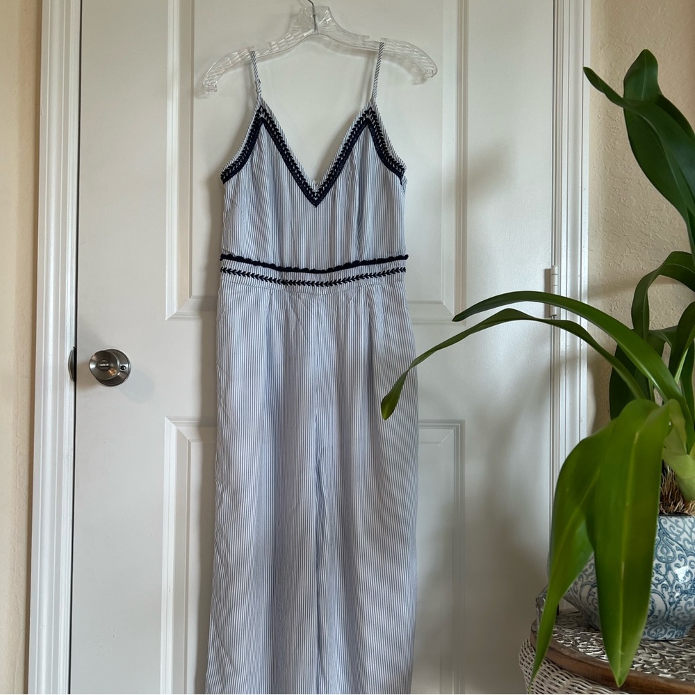 Blue stripped jumpsuit, lined and embroidered detailing. It’s giving Greece
